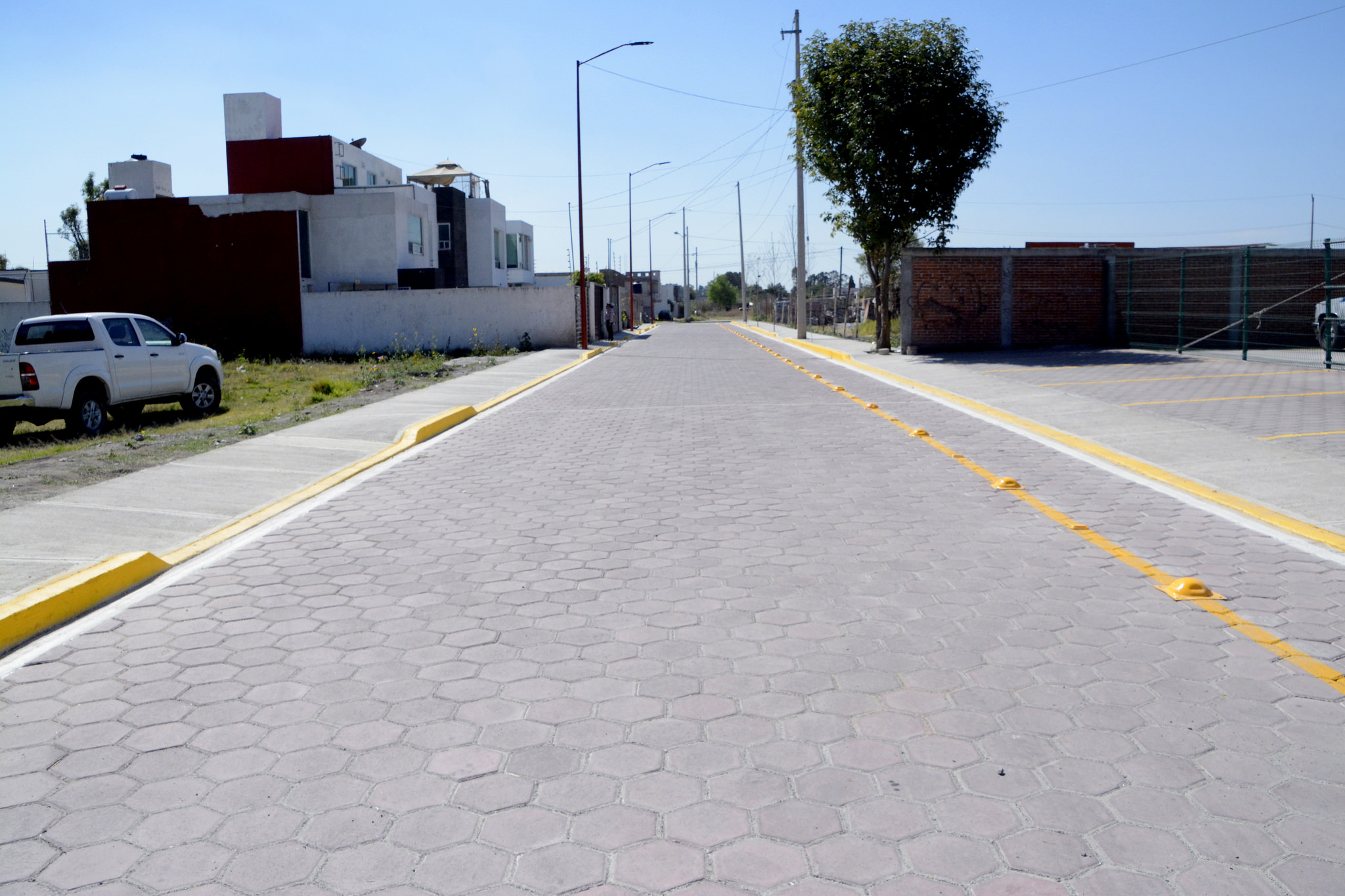 Entrega edil de San Pedro Cholula calle en Mexicaltzingo