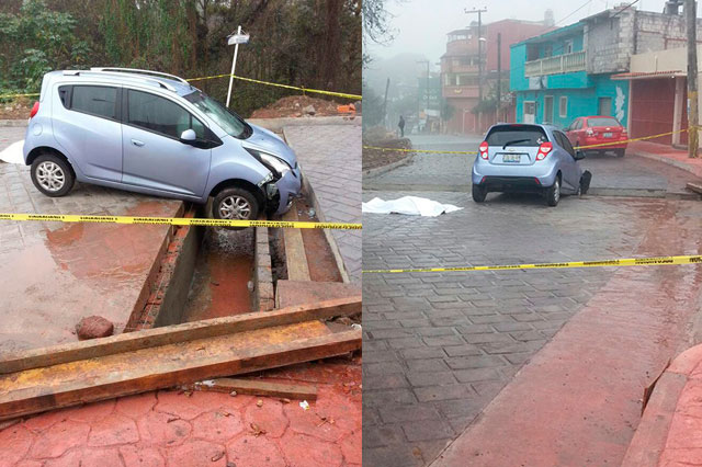 Mujer muere al caer su auto en colector de Huauchinango