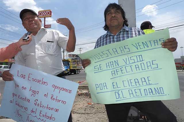 Transportistas y vecinos protestan para exigir retorno en bulevar Forjadores