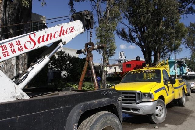 Piden desde San Lázaro se vigile cobro abusivo de grúas en Puebla