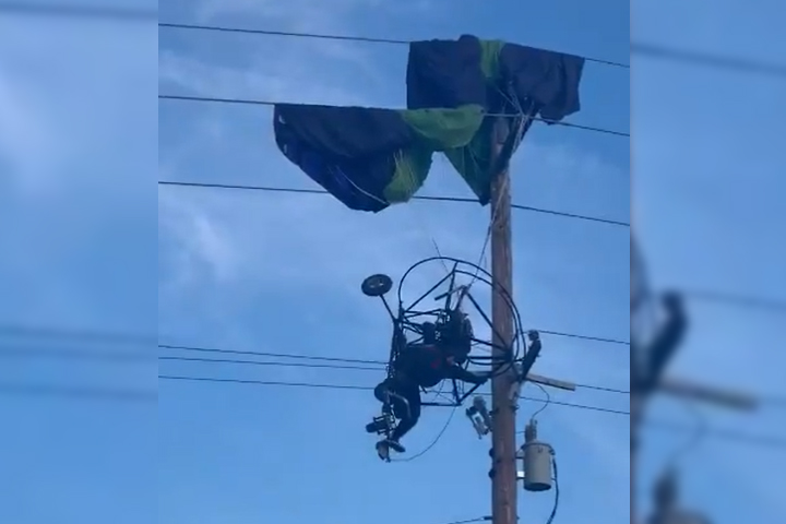 VIDEO Paracaidista termina aterrizaje en cables de luz