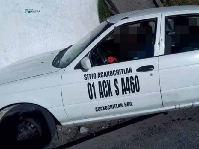 Hallan tres ejecutados en taxi entre Puebla e Hidalgo