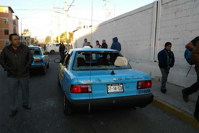 Riña entre taxistas y ambulantes en Texmelucan deja tres heridos